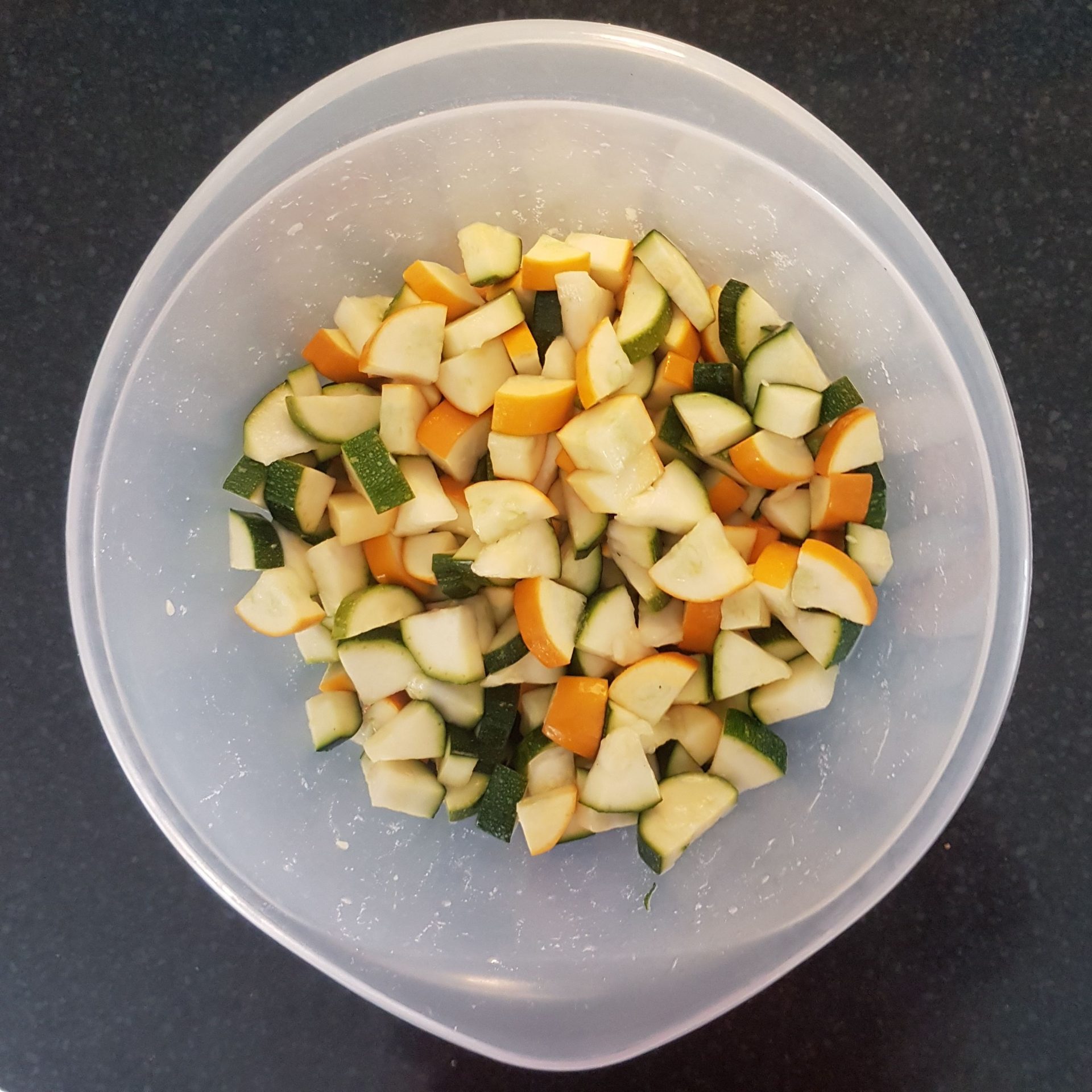 A bowl of green and yellow courgette chunks