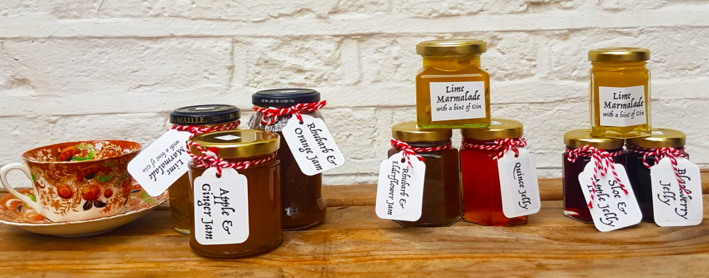 Image showing a range of sizes of filled jam jars from large to small